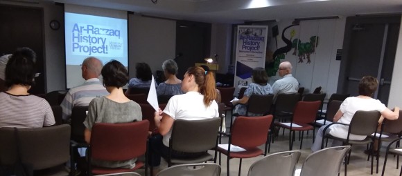 Image of audience at presentation or screening about Ar-Razzaq History Project